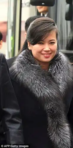  She was all smiles as she visited a gymnasium in Seoul, wearing a statement fur-collared coat