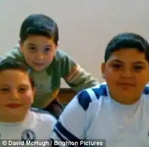 Sulaiman Wihba (far right) with his brothers in Syria before fleeing two years ago