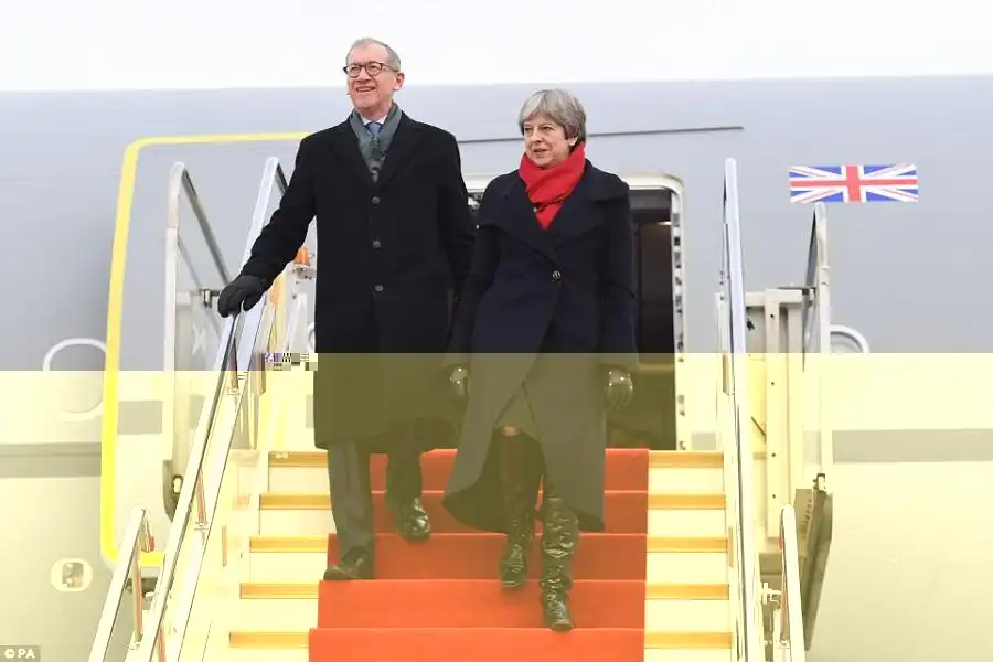 Mrs May and her husband, Philip arrive at Wuhan Tianhe International Airport in Hubei, China