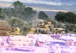 Turkish troops take control of Bursayah hill on Sunday. Turkish troops and allied Syrian fighters captured the strategic hill in northwestern Syria after intense fighting as their offensive to root out Kurdish fighters enters its second week, Turkey's military and Syrian war monitor reported