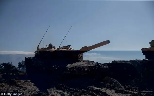 A Turkish tank is seen at Burseya Mountain after military aircraft secured the mountain, having gained it but then lost it again last week 