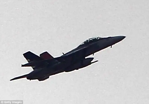 the United States-led coalition has killed as many as 150 Islamic State fighters in an operation in the middle Euphrates River Valley in Syria, officials said Tuesday. A fighter jet is seen flying above Syria in this October 2014 file photo