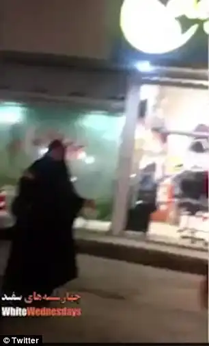 One shocking film shows a man threatening to slap a young woman for breaking the law