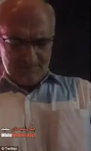 One shocking film shows a man threatening to slap a young woman for breaking the law