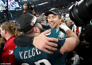 Team hug: Nick Foles, right, celebrates with Jason Kelce on the field after winning Super Bowl LII at U.S. Bank Stadium in Minneapolis, Minnesota, on February 4