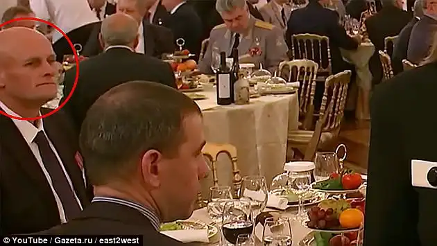 Putin's friend: Dmitry 'Wagner' Utkin, circled, is pictured at the reception dinner at the ceremony in Kremlin