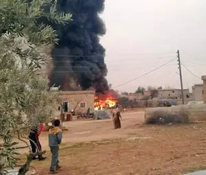 This image appears to show the plane burning on the ground after it was shot down above Syria on Saturday afternoon