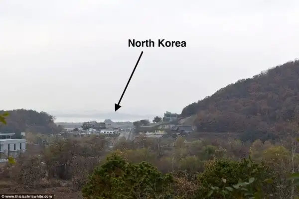 From the top of the 'English Village', you can see the hillsides of North Korea, and hear the propaganda music blaring out all day long, as can be seen in these exclusive image