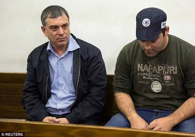 Under arrest: Former  director general of Israel's Communications Ministry, Shlomo Filber, left, has also been arrested in connection with the case, and has agreed to turn state's witness