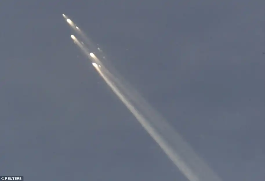 Back to earth: Pieces of the Russian space station Mir races across the sky above Fiji as it makes its descent into the earth's atmosphere March 23, 2001