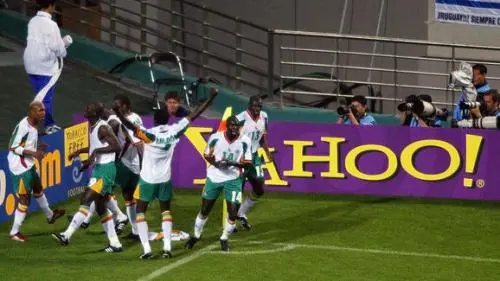 Members of the Senegal team celebrate after midfie