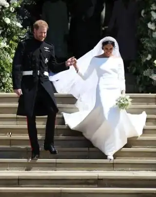 Prince Harry, Duke of Suss3x and Meghan, Duchess of Suss3x leave St George's Chapel, Windsor Castle after their wedding ceremony on 19 May 2018