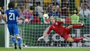 English goalkeeper Joe Hart (R) dives as
