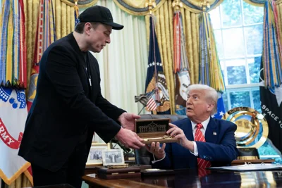 (FILES) US President Donald Trump presents a "key to the White House" to Elon Musk during a news conference in the Oval Office of the White House in Washington, DC, on May 30, 2025. Trump and Musk's unlikely political marriage exploded in a fiery public divorce on June 5, 2025. The President Trump said in a televised Oval Office diatribe that he was "very disappointed" after his former aide and top donor criticized his "big, beautiful" spending bill before Congress. The pair then hurled insults at each other on social media -- with Musk even posting, without proof, that Trump was referenced in government documents on disgraced financier and sex offender Jeffrey Epstein. (Photo by Allison ROBBERT / AFP) (Photo by ALLISON ROBBERT/AFP via Getty Images)