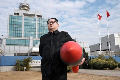 Howard X, an Australian-Chinese impersonating North Korean leader Kim Jong-un walks towards the police station with his inflatable rocket to report for his bail, in Hong Kong, China January 20, 2021. REUTERS/Tyrone Siu