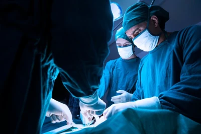 concentrated professional surgical doctor team operating surgery a patient in the operating room at the hospital. healthcare and medical concept. ; Shutterstock ID 1897106482; purchase_order: -; job: -; client: -; other: -