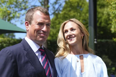 Peter Phillips and Harriet Sperling pose for photographers as they arrive for day ten at the Wimbledon Tennis Championships in London, Wednesday, July 9, 2025. (AP Photo/Joanna Chan)