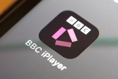 A close-up of the BBC iPlayer app icon on an iPhone home screen.