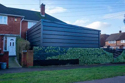An exterior view of 26 Aycliffe Road in Borehamwood, showing the contentious garage structure.