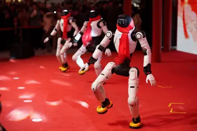 Humanoid robots perform a synchronised dance during a Lunar New Year tech temple fair in Beijing, China.
