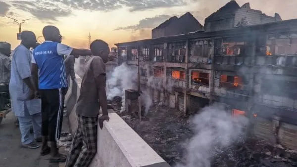 Firefighters tackling the large blaze at Kano's Singer Market.